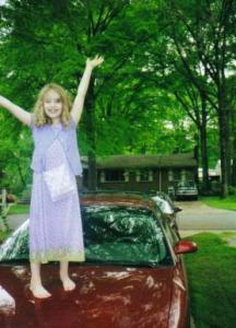 Sarah Playing on the Hood of My Sable Station Wagon (c. 1999)