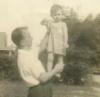 D.F. Holding Baby Pops (c. 1941)